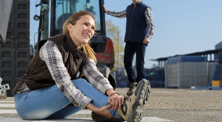 Abbey Court Solicitors | Personal InjuryYoung woman laughing near bus with male passenger boarding Young woman laughing near bus with male passenger boarding