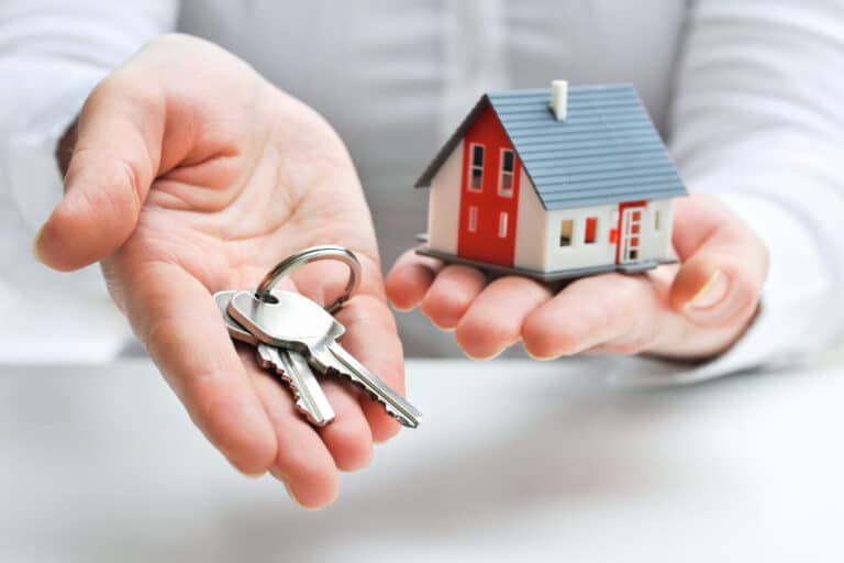 Abbey Court Solicitors | The steps involved in selling a propertyPerson holding house keys and miniature red home model Person holding house keys and miniature red home model
