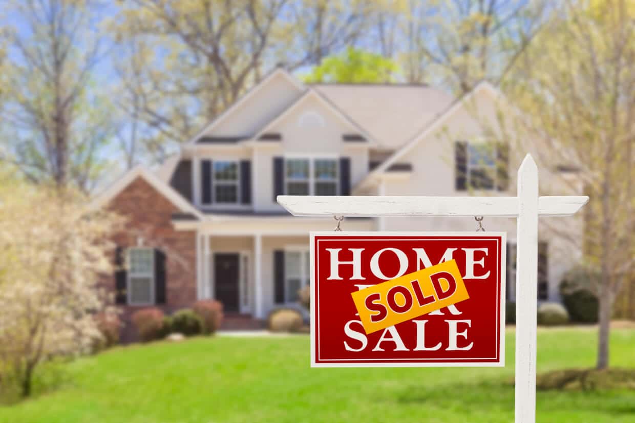 Abbey Court Solicitors | Buying or Selling a Property newHome sold sign in front of brick house Home sold sign in front of brick house
