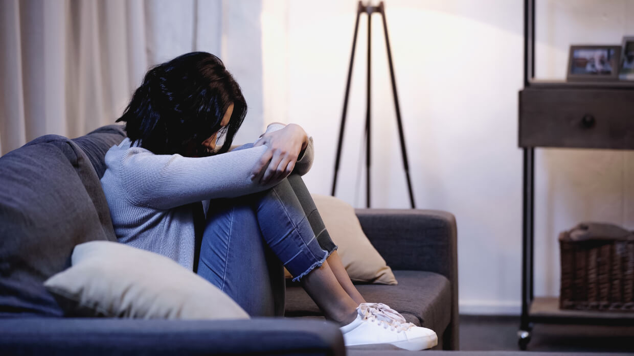 Abbey Court Solicitors | Psychological Injury from Witnessing an Accident / Secondary VictimWoman sitting on sofa displaying signs of sadness or distress Woman sitting on sofa displaying signs of sadness or distress