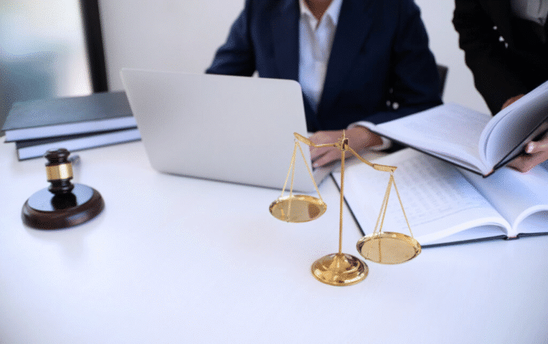 Family Law Solicitors Lawyer at desk with scales of justice and legal documents