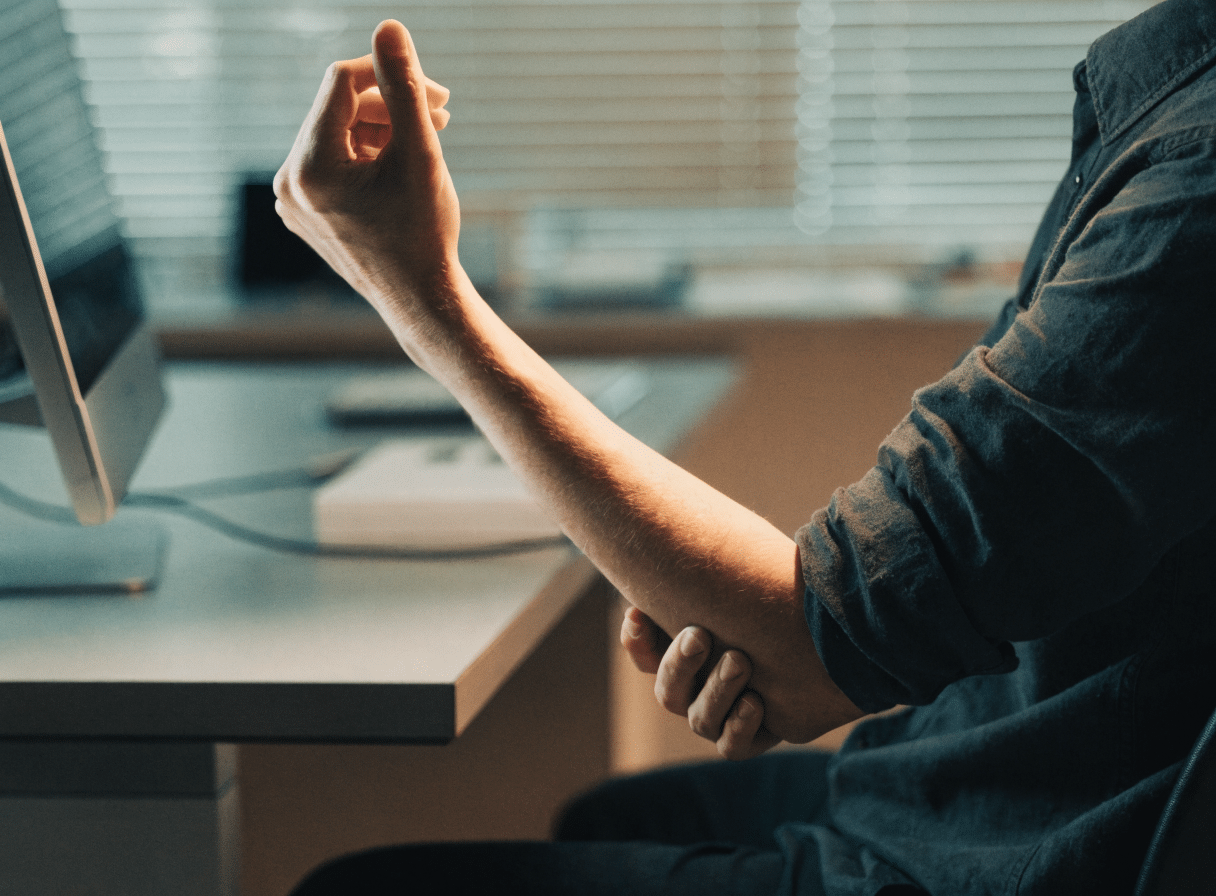 Abbey Court Solicitors | Signs of Repetitive Strain Injury: What to Look Out ForOffice worker stretching to relieve repetitive strain injury symptoms Office worker stretching to relieve repetitive strain injury symptoms